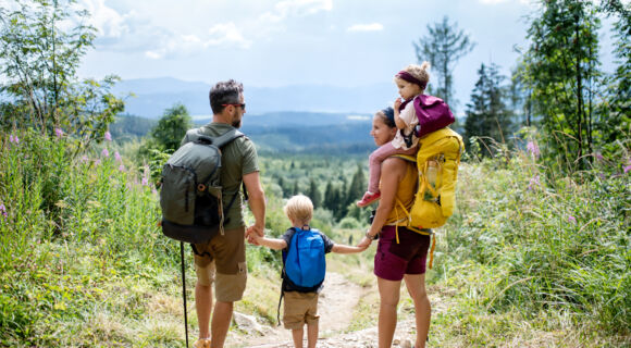 rear-view-of-family-with-small-children-hiking-out-2026-03-10-02-10-50-utc