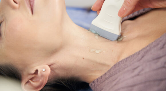 sonographer-examining-patient-thyroid-gland-with-u-2026-01-08-07-39-36-utc